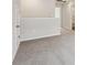 A carpeted room showcasing neutral walls, an open doorway and a hallway with white trim at 3921 Brushy St, Powder Springs, GA 30127