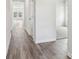 Hallway showcasing hardwood flooring and access to the living room and other areas of the home at 3921 Brushy St, Powder Springs, GA 30127