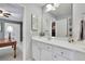 Bright bathroom with a white vanity and large mirror at 4760 Green Summers Dr, Cumming, GA 30028