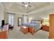 Spacious bedroom with tray ceilings, natural lighting, and neutral decor at 4760 Green Summers Dr, Cumming, GA 30028