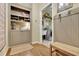 Hallway with hardwood flooring and view into the laundry room at 4760 Green Summers Dr, Cumming, GA 30028