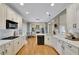 Spacious kitchen with white cabinets, marble countertops, and hardwood floors at 4760 Green Summers Dr, Cumming, GA 30028