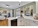 Modern kitchen with white cabinets, quartz countertops, and island at 4760 Green Summers Dr, Cumming, GA 30028