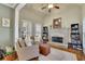 Cozy living room with stone fireplace, built in shelving, and hardwood floors at 4760 Green Summers Dr, Cumming, GA 30028