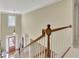 Elegant staircase with wooden railing and neutral wall paint at 4760 Green Summers Dr, Cumming, GA 30028