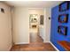 Functional mud room with a view to the kitchen with stainless appliances and a stacked washer dryer at 132 Hammond Dr, Canton, GA 30114