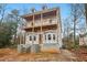 Two-story house under construction with wrap-around porch at 3160 Hathaway Ct, Atlanta, GA 30341