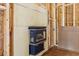 A new gas fireplace is installed in the frame of a new house at 3160 Hathaway Ct, Atlanta, GA 30341