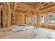 Spacious living room in the framing stage, with large windows at 3160 Hathaway Ct, Atlanta, GA 30341