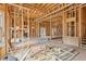 Spacious living room with large windows and fireplace, currently under construction at 3160 Hathaway Ct, Atlanta, GA 30341