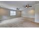 Spacious living room with wall-to-wall carpeting and ceiling fans at 418 Hillview Rd, Hampton, GA 30228