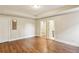 Bright basement bedroom with wood floors and access to a bathroom at 645 Trailmore Pl, Roswell, GA 30076