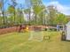 Large backyard with playset, trampoline, and soccer goal at 103 Arbor Oaks Dr, Canton, GA 30115