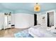 Serene bedroom with a light blue ceiling, a white bed, and a playful decor at 103 Arbor Oaks Dr, Canton, GA 30115