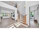 Two-story entryway with a grand staircase and natural light at 103 Arbor Oaks Dr, Canton, GA 30115