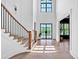 Bright and spacious entryway with a curved staircase and hardwood floors at 103 Arbor Oaks Dr, Canton, GA 30115