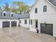 Spacious three-car garage with modern dark gray doors at 103 Arbor Oaks Dr, Canton, GA 30115