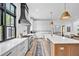 Modern kitchen with white cabinets, a large island and a farmhouse sink at 103 Arbor Oaks Dr, Canton, GA 30115