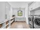 Clean laundry room, featuring ample storage and modern appliances at 103 Arbor Oaks Dr, Canton, GA 30115