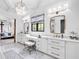 Bathroom with white cabinets, double vanity, and marble floors at 103 Arbor Oaks Dr, Canton, GA 30115