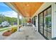 Relaxing covered porch with a swing and stone flooring at 103 Arbor Oaks Dr, Canton, GA 30115