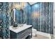 Stylish powder room, boasting a unique blue patterned wall at 103 Arbor Oaks Dr, Canton, GA 30115