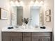 Double vanity bathroom with modern fixtures at 1149 Chastain Dr # 62, Sugar Hill, GA 30518