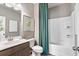 Clean bathroom with tub, shower, and modern vanity at 1149 Chastain Dr # 62, Sugar Hill, GA 30518