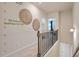 Upstairs hallway with 9ft ceilings and unique wall decor at 1149 Chastain Dr # 62, Sugar Hill, GA 30518