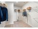 Large walk-in closet with ample shelving at 1149 Chastain Dr # 62, Sugar Hill, GA 30518