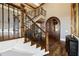 Elegant foyer with hardwood floors, wooden staircase, and ornate wrought iron railings at 89 Somerset Ln, Cartersville, GA 30121