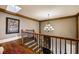 Upstairs hall with hardwood floors and chandelier at 89 Somerset Ln, Cartersville, GA 30121