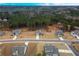 Aerial view of a residential neighborhood with houses and tree-covered areas at 1121 Red Oak Ln, Loganville, GA 30052