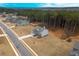 Aerial view of a house and surrounding community, showcasing a tree-lined neighborhood at 1121 Red Oak Ln, Loganville, GA 30052