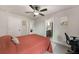 Spacious bedroom with a queen bed, en-suite bathroom access, and a workspace at 1121 Red Oak Ln, Loganville, GA 30052