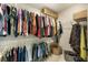 Walk-in closet with metal shelving, hanging clothes, and woven storage baskets at 1121 Red Oak Ln, Loganville, GA 30052