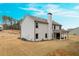 Two-story house with gray siding, covered porch, and landscaped yard at 1121 Red Oak Ln, Loganville, GA 30052