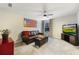 Comfortable living room featuring an American flag, leather sofa and flat screen television at 1121 Red Oak Ln, Loganville, GA 30052