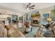 Cozy living room with a brick fireplace, large windows, and hardwood flooring at 1121 Red Oak Ln, Loganville, GA 30052