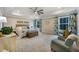 Spacious main bedroom with tray ceilings, neutral colors, and an abundance of natural light at 1121 Red Oak Ln, Loganville, GA 30052