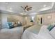 Bright main bedroom featuring a ceiling fan and ensuite access at 1121 Red Oak Ln, Loganville, GA 30052