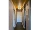 Hallway with patterned wallpaper and gold ceiling at 2479 Peachtree Ne Rd # 1410, Atlanta, GA 30305