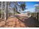 Backyard view of home with shed and wooden fence at 4785 Old Douglasville Rd, Lithia Springs, GA 30122