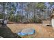 Backyard with pile of gravel and mature trees at 4785 Old Douglasville Rd, Lithia Springs, GA 30122