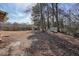 Large backyard area with mature trees and a shed at 4785 Old Douglasville Rd, Lithia Springs, GA 30122