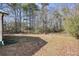 Wooded backyard with a fire pit area at 4785 Old Douglasville Rd, Lithia Springs, GA 30122