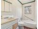 Small bathroom with bathtub, toilet and sink at 4785 Old Douglasville Rd, Lithia Springs, GA 30122