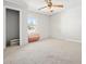 Bedroom with window, ceiling fan and carpet at 4785 Old Douglasville Rd, Lithia Springs, GA 30122