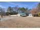 Cute ranch home with green roof, carport, and detached shed at 4785 Old Douglasville Rd, Lithia Springs, GA 30122