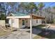 House with green metal roof and covered porch, spacious backyard at 4785 Old Douglasville Rd, Lithia Springs, GA 30122